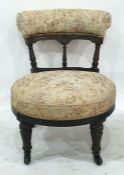 Low Victorian chair with upholstered top rail, carved mahogany back, upholstered seat, turned