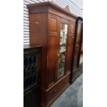 Edwardian walnut wardrobe with single glazed door,