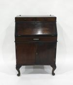 20th century bureau, a narrow bookcase and a walnut cabinet with single drawer above open recess