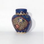Japanese pottery jar and cover of baluster form, decorated with a cloisonne-effect design, with