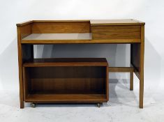 20th century oak dressing table with lift-top compartment to the right and an oak bookcase on wheels