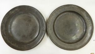 Two pewter chargers, one bearing touchmarks, 45.5cm diameter (2)