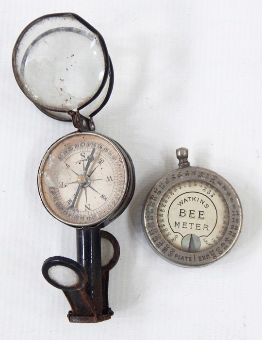 Watkins 'Bee Meter' light meter, and a small compass with folding supports