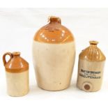 Three stoneware demijohn bottles, one marked 'Cheltenham Original Brewery Compy Ltd' and numbered