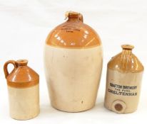 Three stoneware demijohn bottles, one marked 'Cheltenham Original Brewery Compy Ltd' and numbered