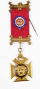 9ct gold and enamel Royal Antediluvian Order of Buffaloes medal, the buffalo with ruby cabochon