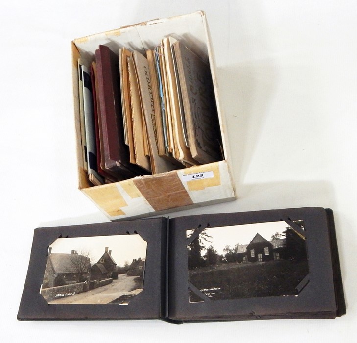 Box of assorted postcards to include 'Treasure of Tutankhamun' and an album of travel