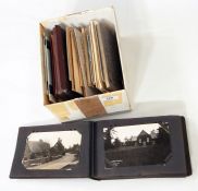 Box of assorted postcards to include 'Treasure of Tutankhamun' and an album of travel