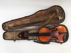 Half-size violin in case, bearing paper label to interior, with three bows and another small