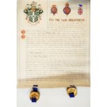 Two charters for the declaration of assigning coats of arms within fitted leather boxes bearing