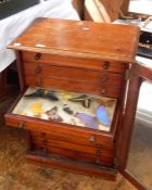 19th century mahogany collectors cabinet, the glazed door enclosing ten drawers and contents of