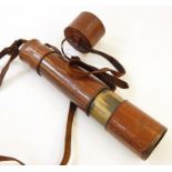 Brass and brown leather cased three-draw telescope
