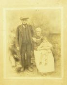19th century  photographs- portrait study of an elderly couple sitting by a range, the gentleman