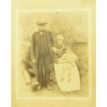 19th century  photographs- portrait study of an elderly couple sitting by a range, the gentleman