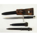 Swiss 1957 pattern bayonet with scabbard and frog, and a socket bayonet and scabbard (2)