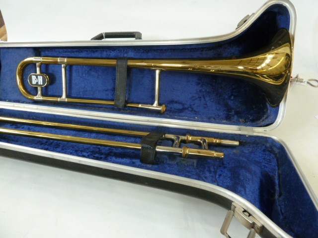 Trombone by Boosey & Hawkes, in fitted case with music stand, mute and accessories