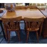 Pine kitchen/dining table on turned supports and four pine railback dining chairs