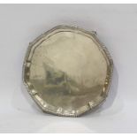 Silver salver, circular and plain with serpentine border, London 1944 on four tab feet, 20cm
