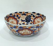 Japanese Imari porcelain punchbowl painted in typi