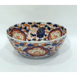 Japanese Imari porcelain punchbowl painted in typi