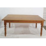 20th century pine rectangular dining table on four turned supports and a set of six pine-framed