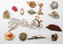 Suitcase and contents of costume jewellery including shell and bead necklaces, a quantity of watch