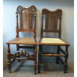 Two late 17th century and later oak chairs of similar style with shaped and carved top rails, cane