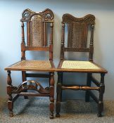 Two late 17th century and later oak chairs of similar style with shaped and carved top rails, cane