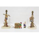 Pair of Goebel pottery lamp bases modelled as children being chased up trees by dogs, each 30.5cm