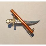 White and yellow metal dagger and scroll pattern bar brooch