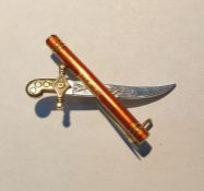 White and yellow metal dagger and scroll pattern bar brooch
