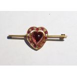 Gold, cabochon garnet, ruby and diamond bar brooch