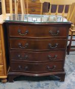 Reproduction mahogany serpentine fronted chest of four long drawers with fluted canted corners on