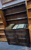 20th century oak dresser with two shelves above a base of two drawers and two cupboard doors, 106.