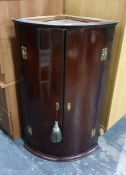 19th century mahogany bowfront wall hanging two-door corner cupboard with two doors opening to