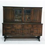 20th century oak dresser, the two central leaded glazed doors flanked by linen fold panelled doors