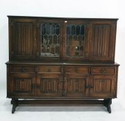 20th century oak dresser, the two central leaded glazed doors flanked by linen fold panelled doors