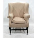 Georgian style shaped-wing square-back armchair with outscroll arms in loose covers and having 'H'