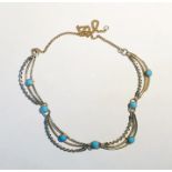 9ct gold, metal and turquoise necklace, the fine curb link chain inset four crescent-shaped openwork