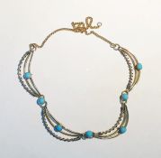 9ct gold, metal and turquoise necklace, the fine curb link chain inset four crescent-shaped openwork