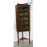 Edwardian inlaid mahogany corner cupboard having four shelves enclosed by astragal glazed door,