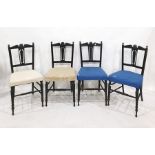 Set of four Victorian ebonised chairs with carved and pierced back splats above upholstered seats (