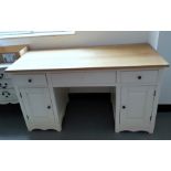 Modern oak desk, the rectangular top above a cream painted base of three drawers and twin end
