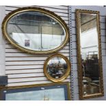Three various gilt framed mirrors including a tall bevelled edged dressing mirror, a large oval