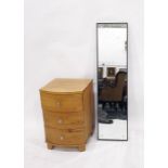 Oak bowfront bedside chest of three drawers and a