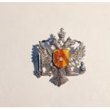 9ct white gold and enamel armorial brooch with enamelled shield, on twin-headed eagle white metal
