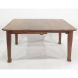 Late 19th/early 20th century oak extending dining table raised upon four tapering square supports,
