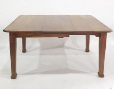 Late 19th/early 20th century oak extending dining table raised upon four tapering square supports,