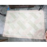Cream ground rug with pale pink and green lattice decoration, 151cm x 111cm