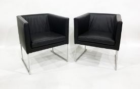Two mid 20th century black leather tub type chairs on chrome base (2)